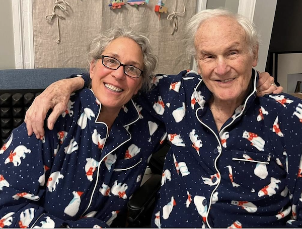 Jodie and her dad in Christmas PJs